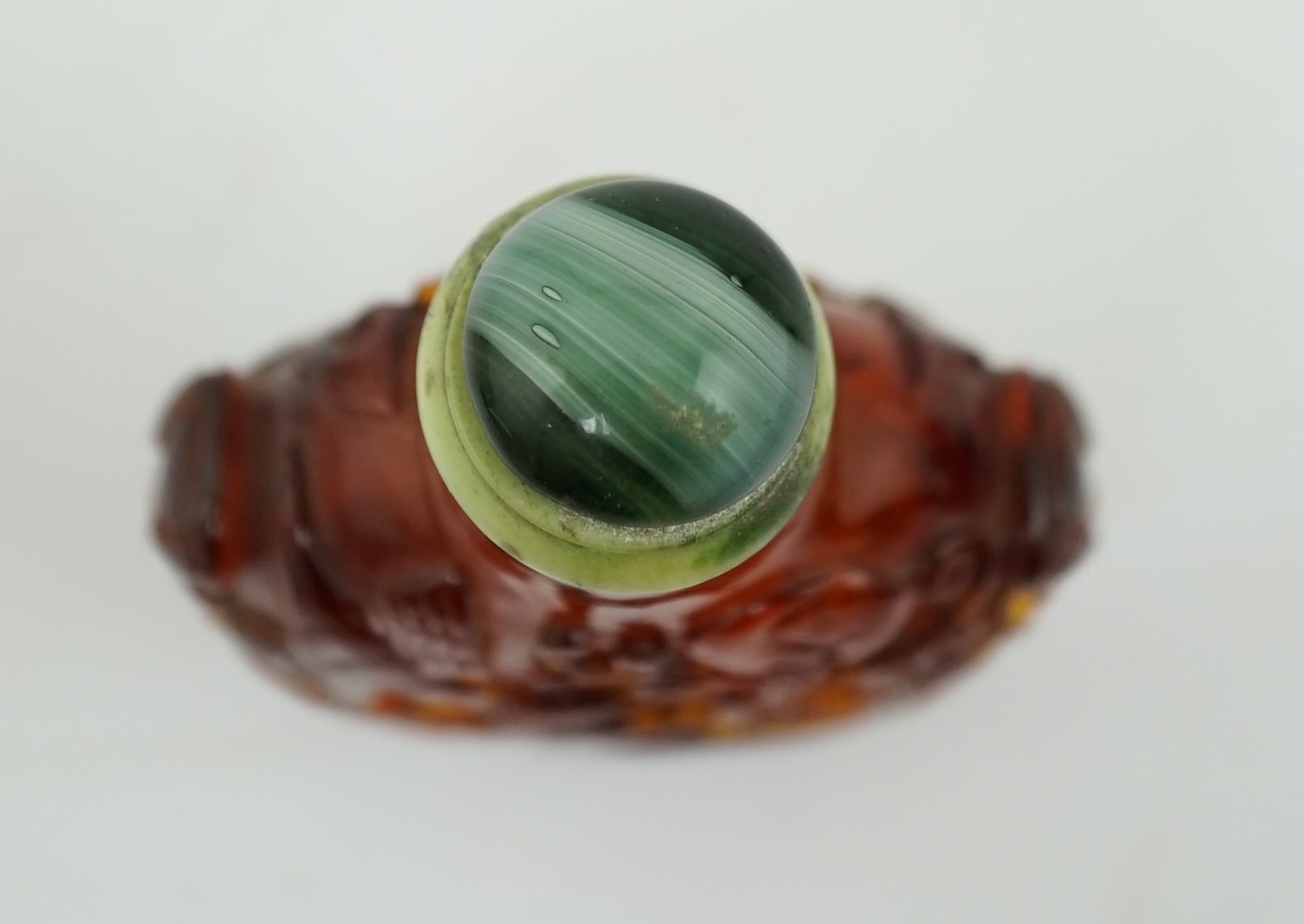 A Chinese carved amber snuff bottle, 19th century